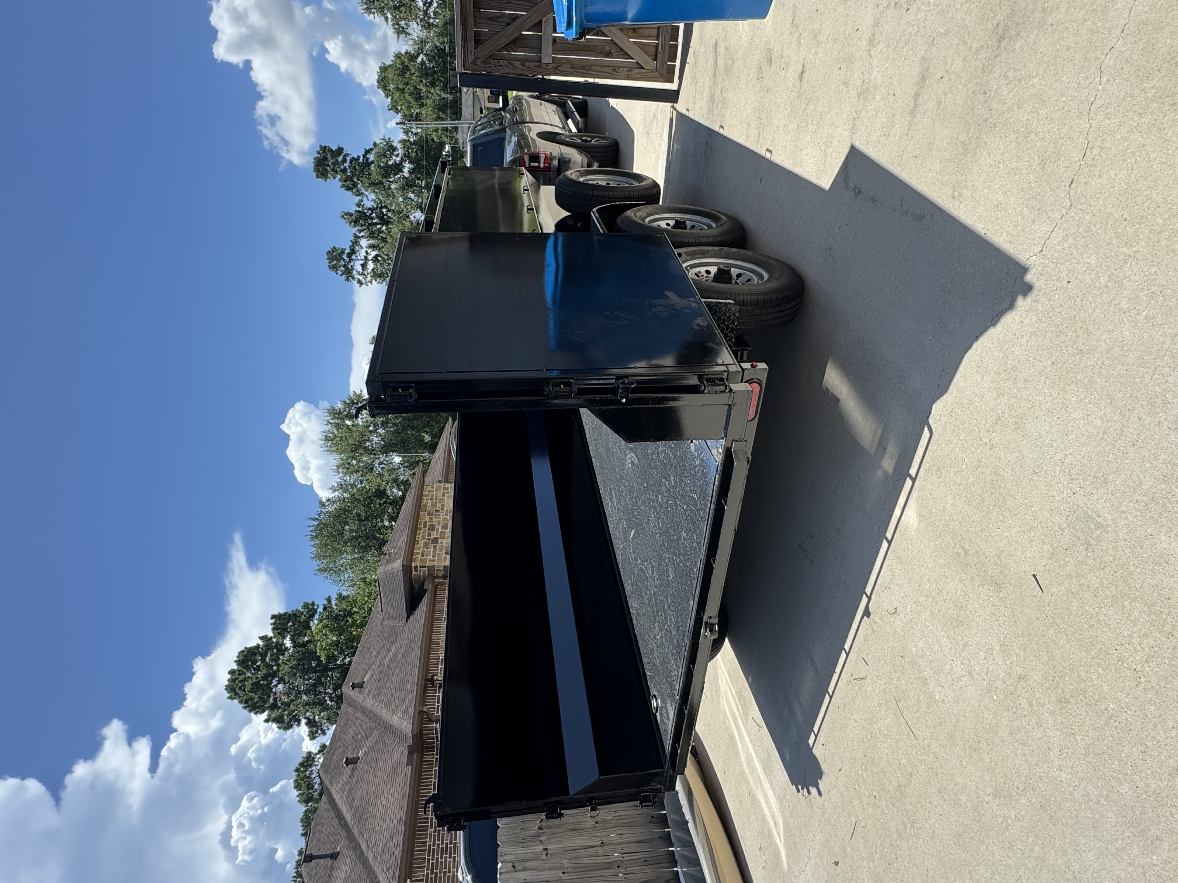 Driveway-safe trailer protecting residential property